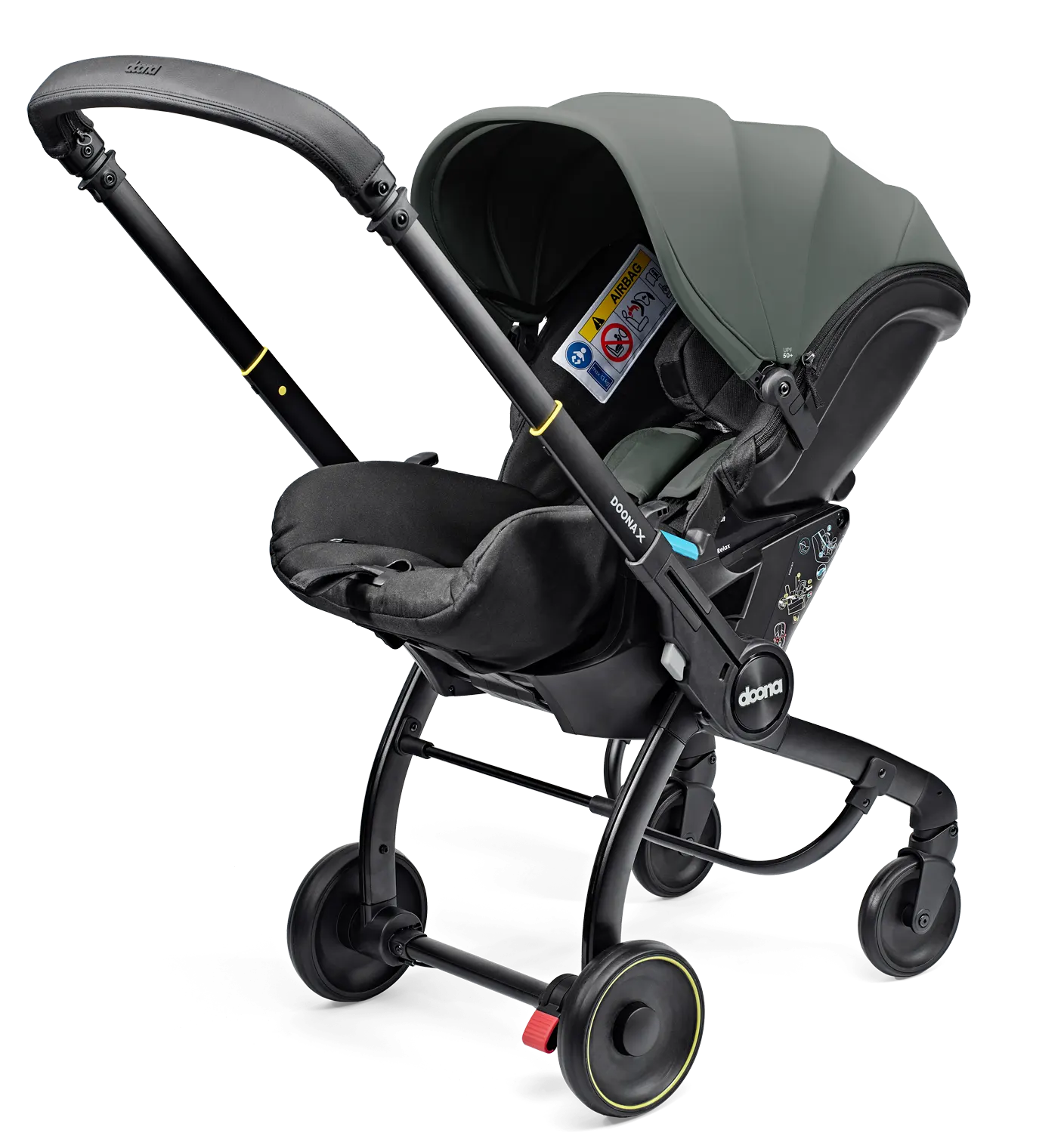 Doona X Babyschale Slate Green in Kinderwagen‑Modus unterwegs